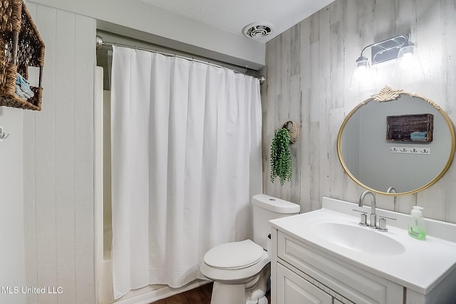 bathroom with toilet, shower / bath combination with curtain, vanity, and visible vents