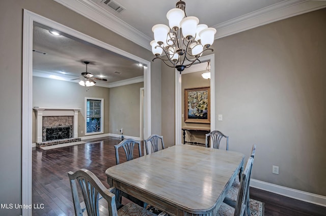 135 Mason Way, Madison, MS 39110 - dining room with dark wood-type flooring, crown molding, a ceiling fan, a fireplace with raised hearth, and baseboards