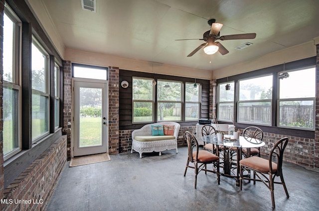 135 Mason Way, Madison, MS 39110 - sunroom / solarium with brick wall, plenty of natural light, and concrete flooring