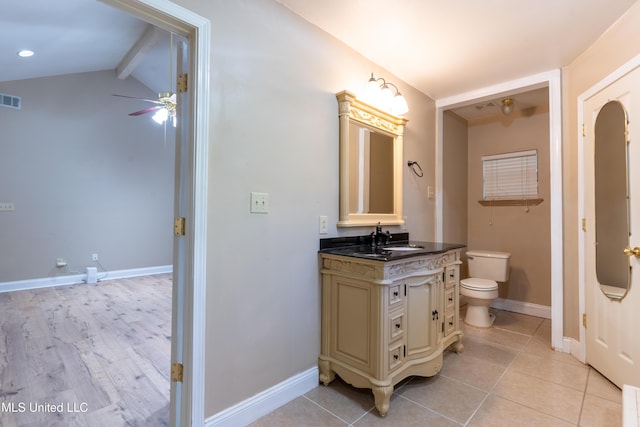 bathroom with ceiling fan, toilet, baseboards, vanity, and tile patterned floors