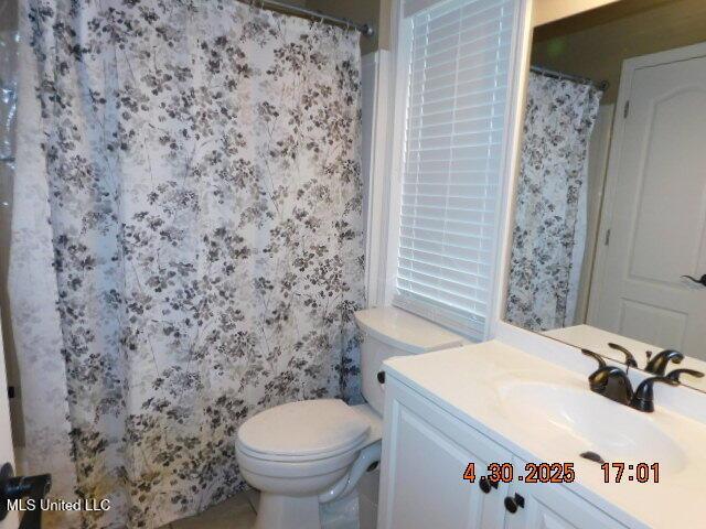 5881 Morganton Dr, Olive Branch, MS 38654 - full bath with toilet, wallpapered walls, and vanity