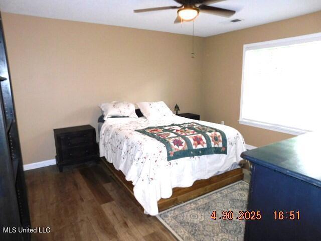 5881 Morganton Dr, Olive Branch, MS 38654 - bedroom with baseboards, ceiling fan, and wood finished floors