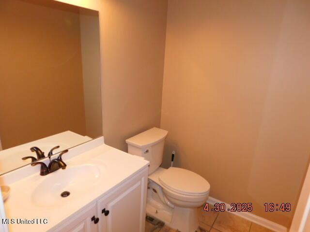 5881 Morganton Dr, Olive Branch, MS 38654 - half bath with vanity, tile patterned flooring, and toilet