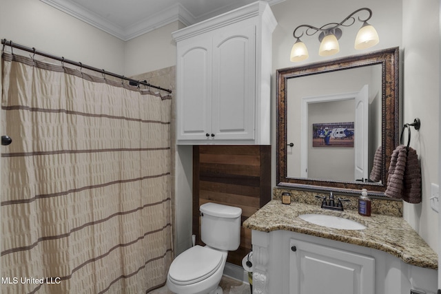 bathroom featuring crown molding, vanity, and toilet