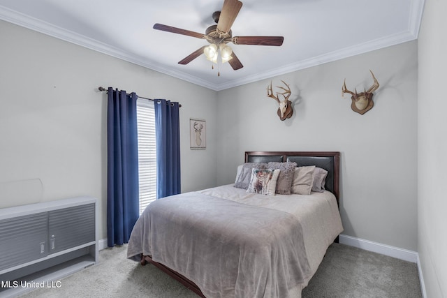 bedroom featuring crown molding, ceiling fan, and carpet