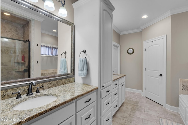 bathroom featuring vanity, crown molding, and a shower with shower door