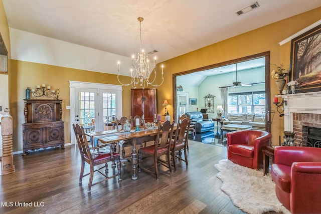 3831 Lake Village Cv, Olive Branch, MS 38654 - dining room featuring wood finished floors, a chandelier, plenty of natural light, and lofted ceiling