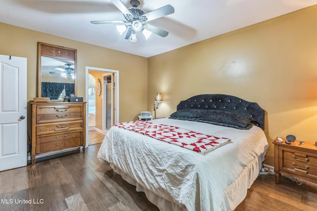 3831 Lake Village Cv, Olive Branch, MS 38654 - bedroom featuring wood finished floors, a ceiling fan, and connected bathroom