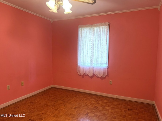 spare room featuring ornamental molding, baseboards, and ceiling fan