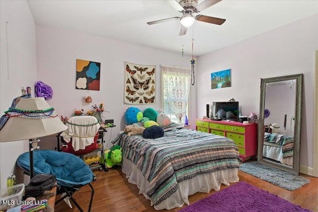 bedroom featuring ceiling fan and hardwood / wood-style floors