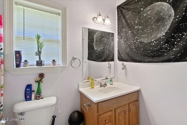 bathroom with vanity and toilet