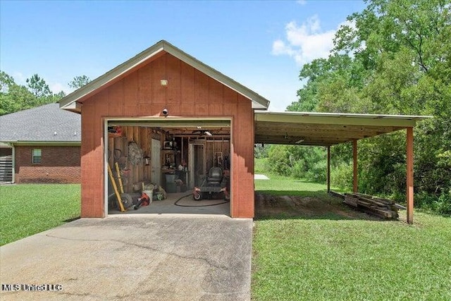 view of outdoor structure featuring a yard and a garage