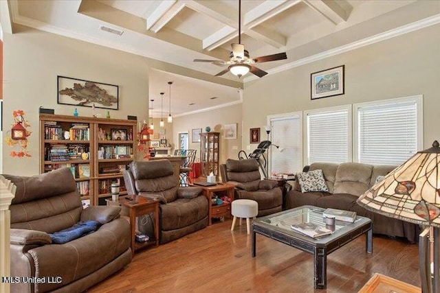 living room featuring hardwood / wood-style floors, beam ceiling, crown molding, and coffered ceiling