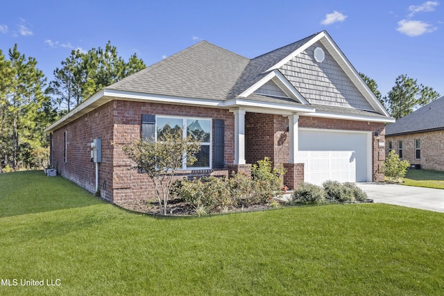 view of front of property with a front yard and a garage