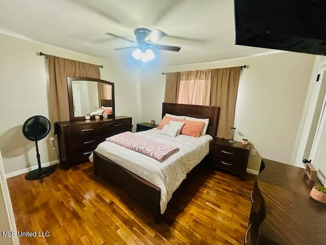 bedroom featuring dark hardwood / wood-style floors and ceiling fan