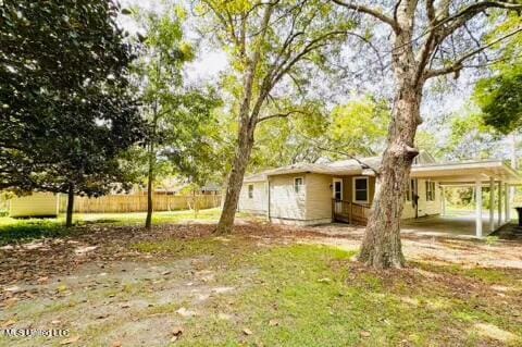 view of yard with a carport