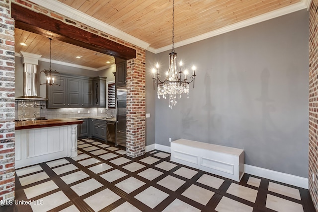 101 Commons Pl, Ridgeland, MS 39157 - unfurnished dining area with baseboards, decorative columns, a sink, wood ceiling, and a chandelier