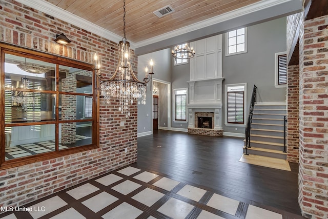101 Commons Pl, Ridgeland, MS 39157 - unfurnished dining area with dark wood-style flooring, wood ceiling, a chandelier, crown molding, and stairway