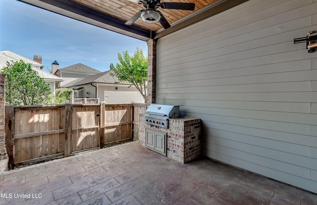 101 Commons Pl, Ridgeland, MS 39157 - view of patio with area for grilling, ceiling fan, fence, and a gate