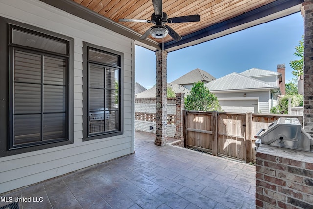 101 Commons Pl, Ridgeland, MS 39157 - view of patio / terrace featuring a gate, a grill, a ceiling fan, fence, and exterior kitchen