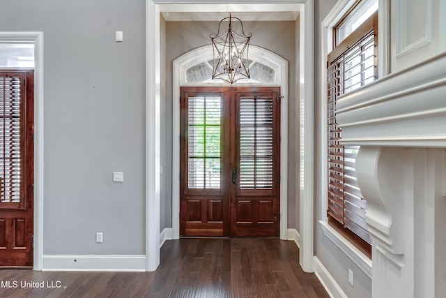 101 Commons Pl, Ridgeland, MS 39157 - entryway with baseboards, dark wood-style flooring, a healthy amount of sunlight, and a chandelier