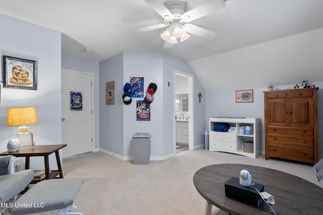 living room with ceiling fan, sink, lofted ceiling, and light carpet