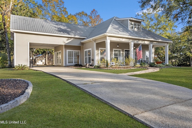 view of front of home with a front lawn, covered porch, and a carport