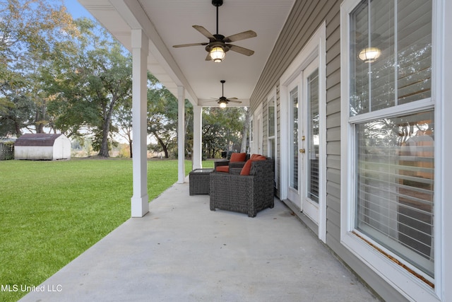 view of patio / terrace with a storage unit and ceiling fan