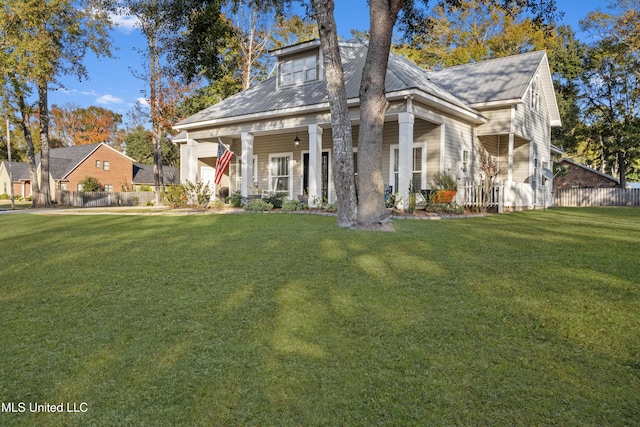 view of front of property featuring covered porch and a front yard