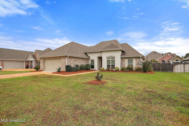 view of front of home featuring a front yard and a garage