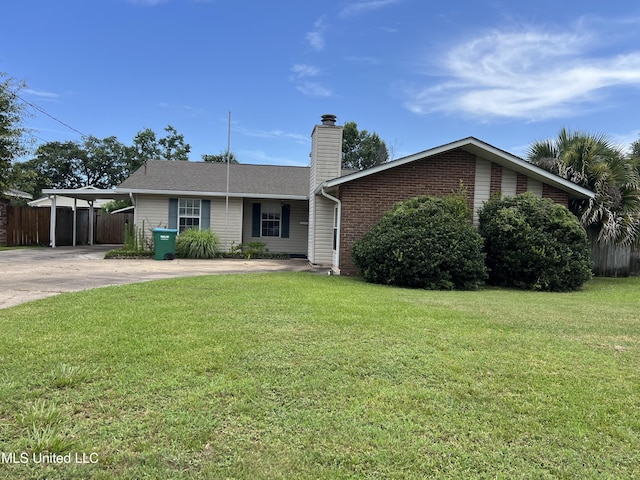2 Concord Pl, Gulfport, MS 39507 - view of front of house with a chimney, concrete driveway, brick siding, and an attached carport