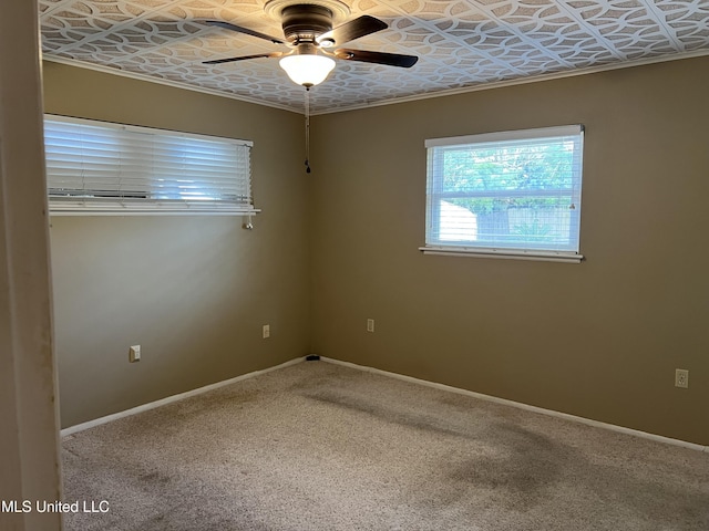2 Concord Pl, Gulfport, MS 39507 - spare room with an ornate ceiling, a ceiling fan, and carpet floors