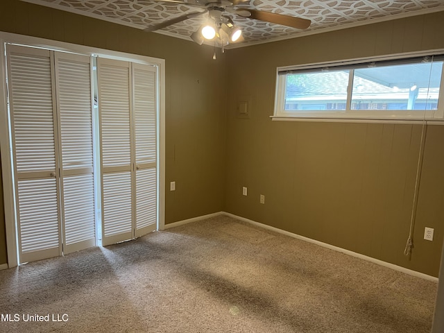2 Concord Pl, Gulfport, MS 39507 - unfurnished bedroom with an ornate ceiling, carpet floors, and a ceiling fan