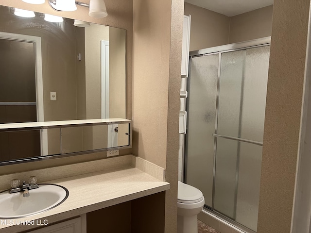 2 Concord Pl, Gulfport, MS 39507 - bathroom featuring a shower stall, vanity, and a textured wall