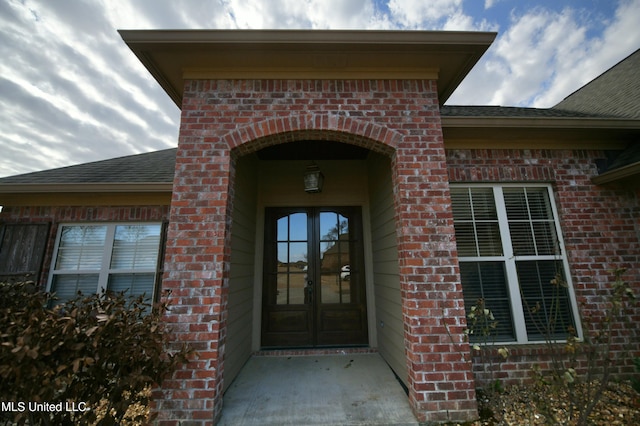 property entrance featuring french doors