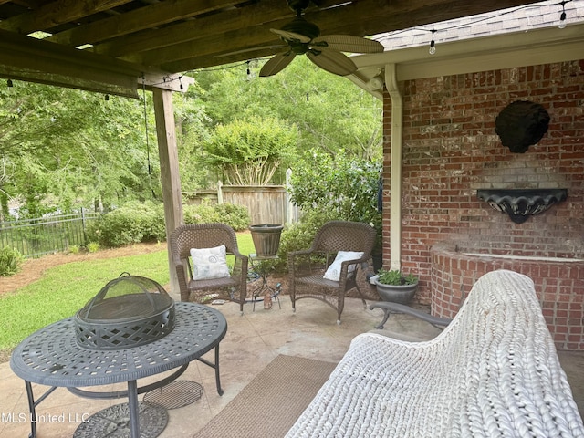 771 Versailles Dr, Ridgeland, MS 39157 - fenced backyard with ceiling fan, a patio area, and a fire pit