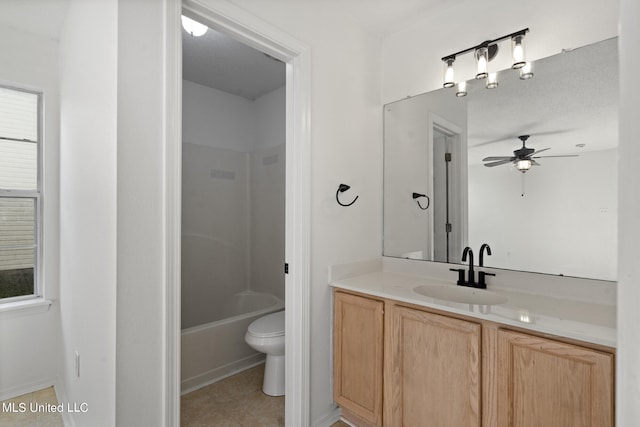 full bathroom featuring vanity, toilet, shower / bathing tub combination, and ceiling fan