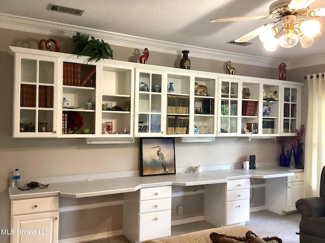 8102 Fairway Villa Dr, Gautier, MS 39553 - unfurnished office featuring built in desk, a ceiling fan, and crown molding