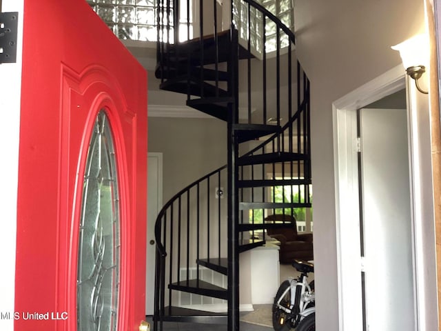 8102 Fairway Villa Dr, Gautier, MS 39553 - stairway featuring a high ceiling and ornamental molding
