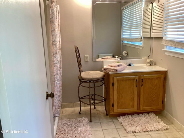 8102 Fairway Villa Dr, Gautier, MS 39553 - bathroom featuring tile patterned floors, vanity, and a shower with curtain