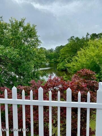 8102 Fairway Villa Dr, Gautier, MS 39553 - fenced yard featuring a water view