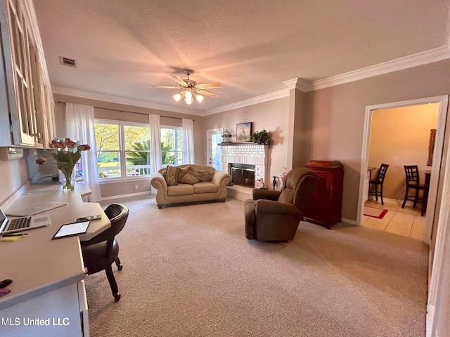 8102 Fairway Villa Dr, Gautier, MS 39553 - living room featuring a fireplace, crown molding, carpet floors, ceiling fan, and a textured ceiling
