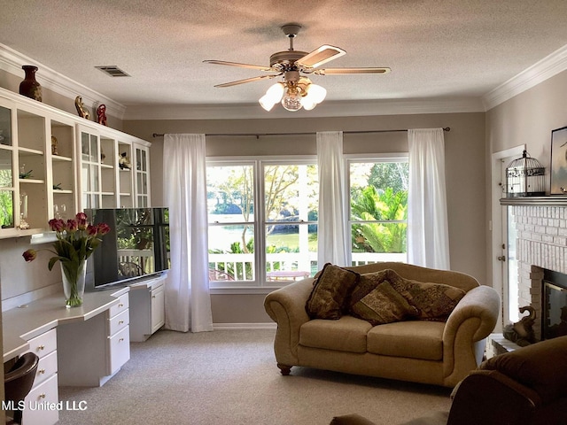 8102 Fairway Villa Dr, Gautier, MS 39553 - living area featuring a ceiling fan, a textured ceiling, plenty of natural light, crown molding, and light carpet