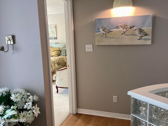 8102 Fairway Villa Dr, Gautier, MS 39553 - hall featuring wood finished floors and baseboards