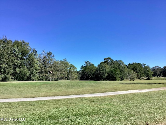 8102 Fairway Villa Dr, Gautier, MS 39553 - surrounding community with a lawn
