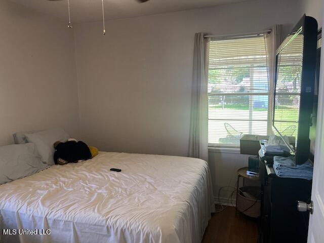 bedroom with wood finished floors