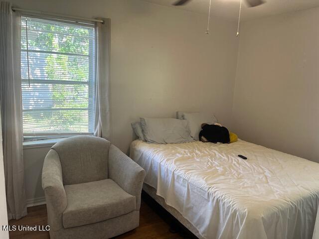 bedroom with wood finished floors