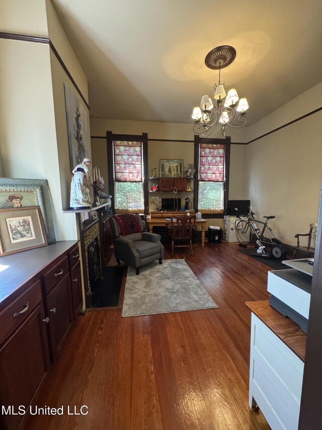 living room featuring a notable chandelier and wood finished floors