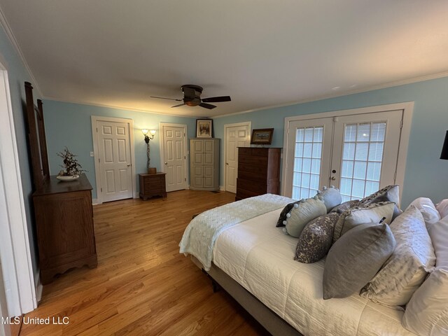 bedroom with french doors, light wood-style flooring, crown molding, and ceiling fan