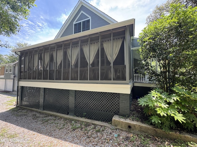 rear view of house with a sunroom